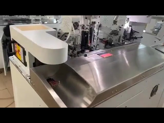 Machine entièrement automatique de sertissage et d'insertion de gaine thermorétractable